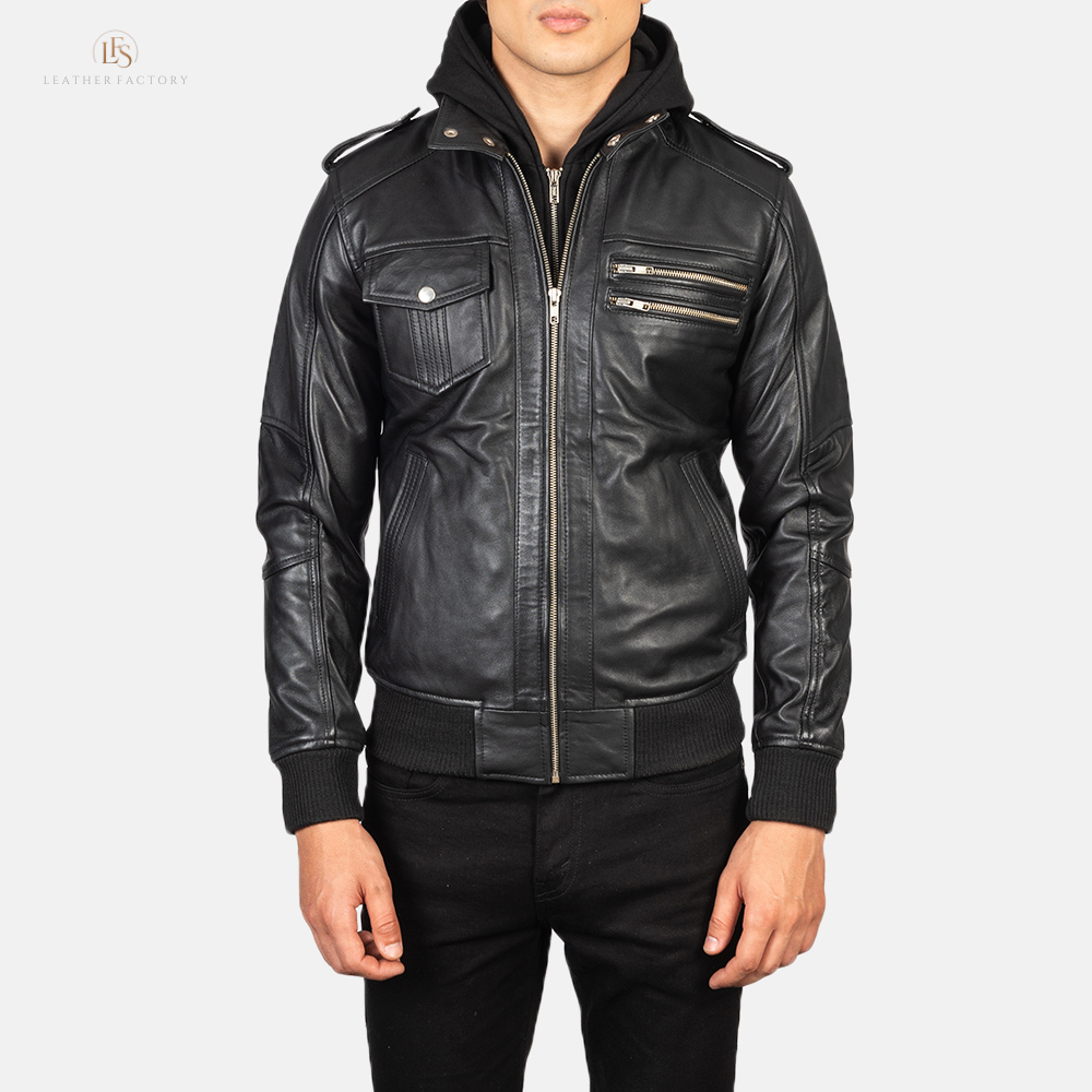 Man wearing a premium black leather bomber jacket with a removable hood and rib knit cuffs