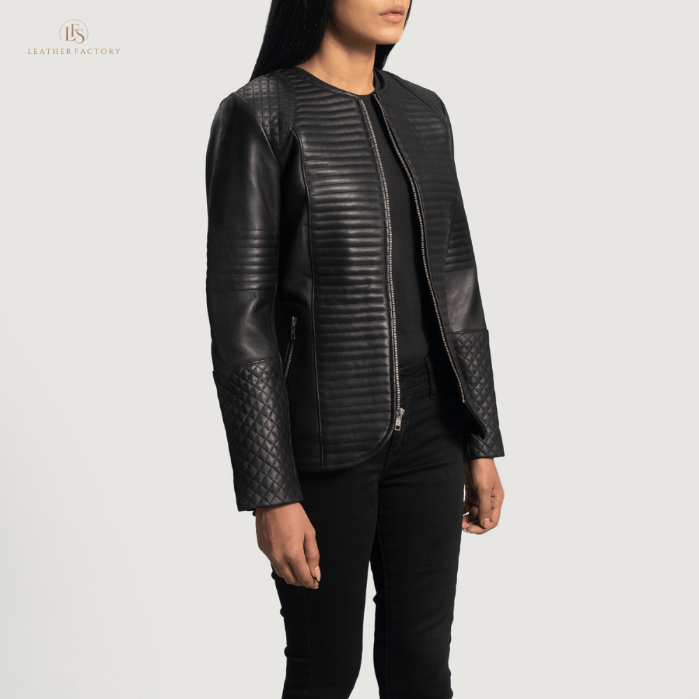 Woman wearing a premium black cowhide leather biker jacket with notch collar, zippered cuffs, removable belt, shoulder epaulettes, and multiple pockets