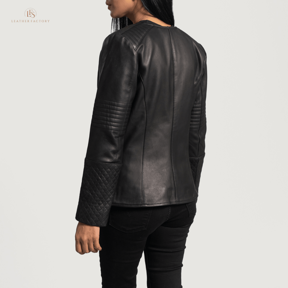 Woman wearing a premium black cowhide leather biker jacket with notch collar, zippered cuffs, removable belt, shoulder epaulettes, and multiple pockets