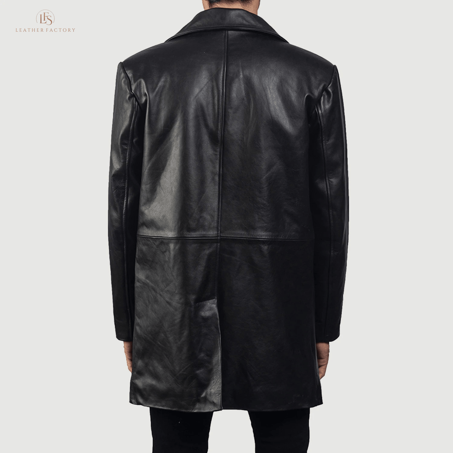Man wearing a premium black genuine cowhide leather long coat with a sharp notch lapel and button front closure