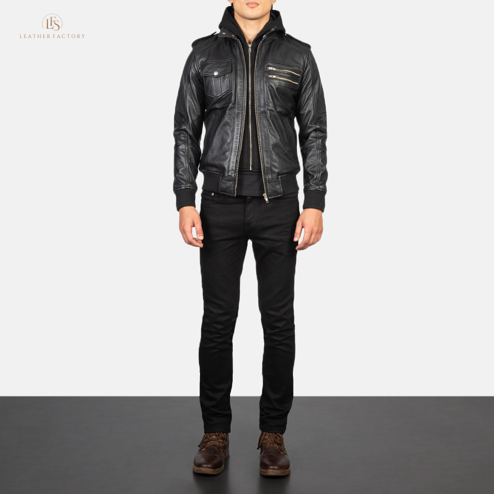 Man wearing a premium black leather bomber jacket with a removable hood and rib knit cuffs