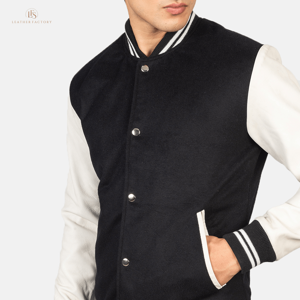 White and black hybrid varsity jacket with genuine sheepskin leather sleeves and soft wool torso