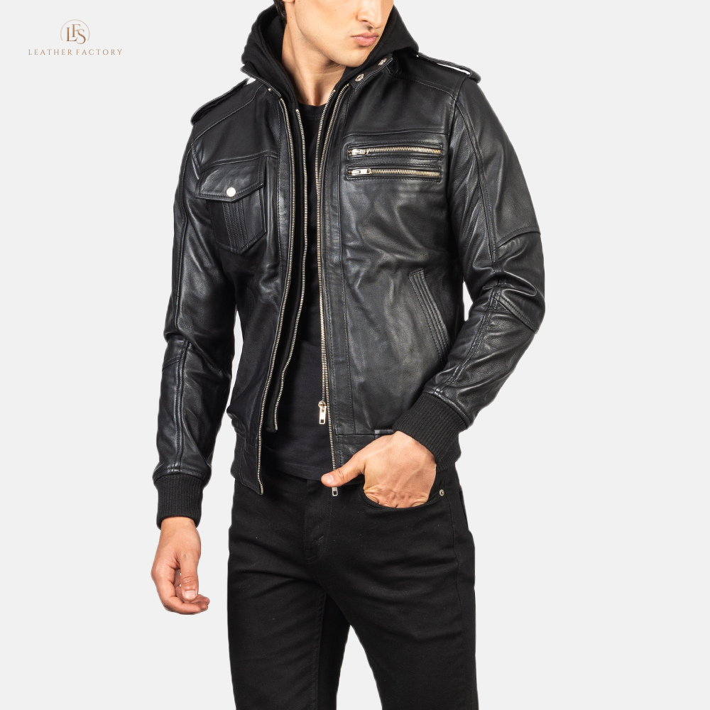 Man wearing a premium black leather bomber jacket with a removable hood and rib knit cuffs