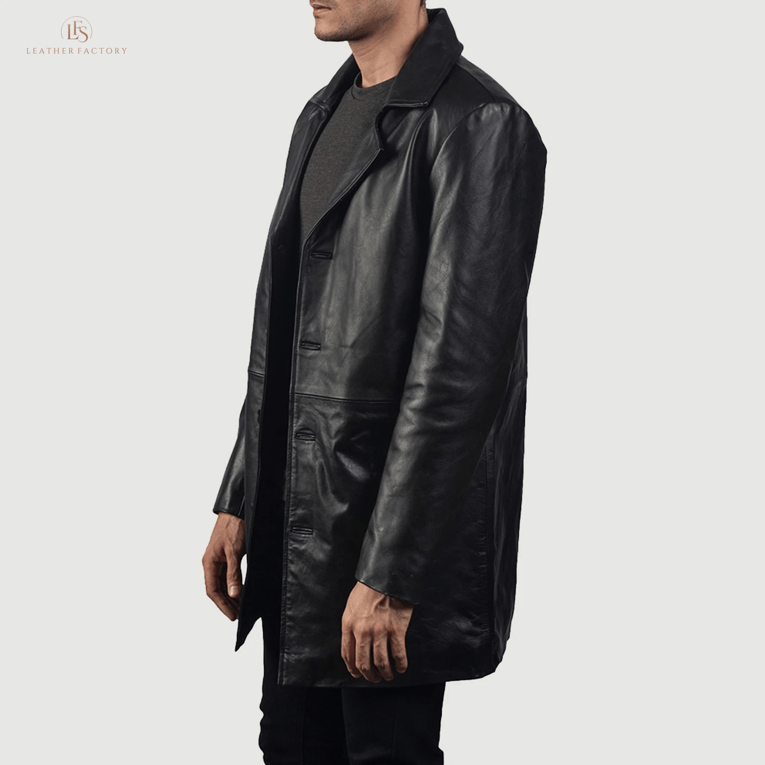 Man wearing a premium black genuine cowhide leather long coat with a sharp notch lapel and button front closure