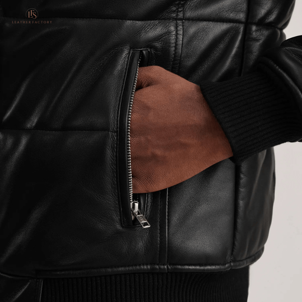 Man wearing a premium black sheepskin leather puffer bomber jacket with high neck and rib knit cuffs