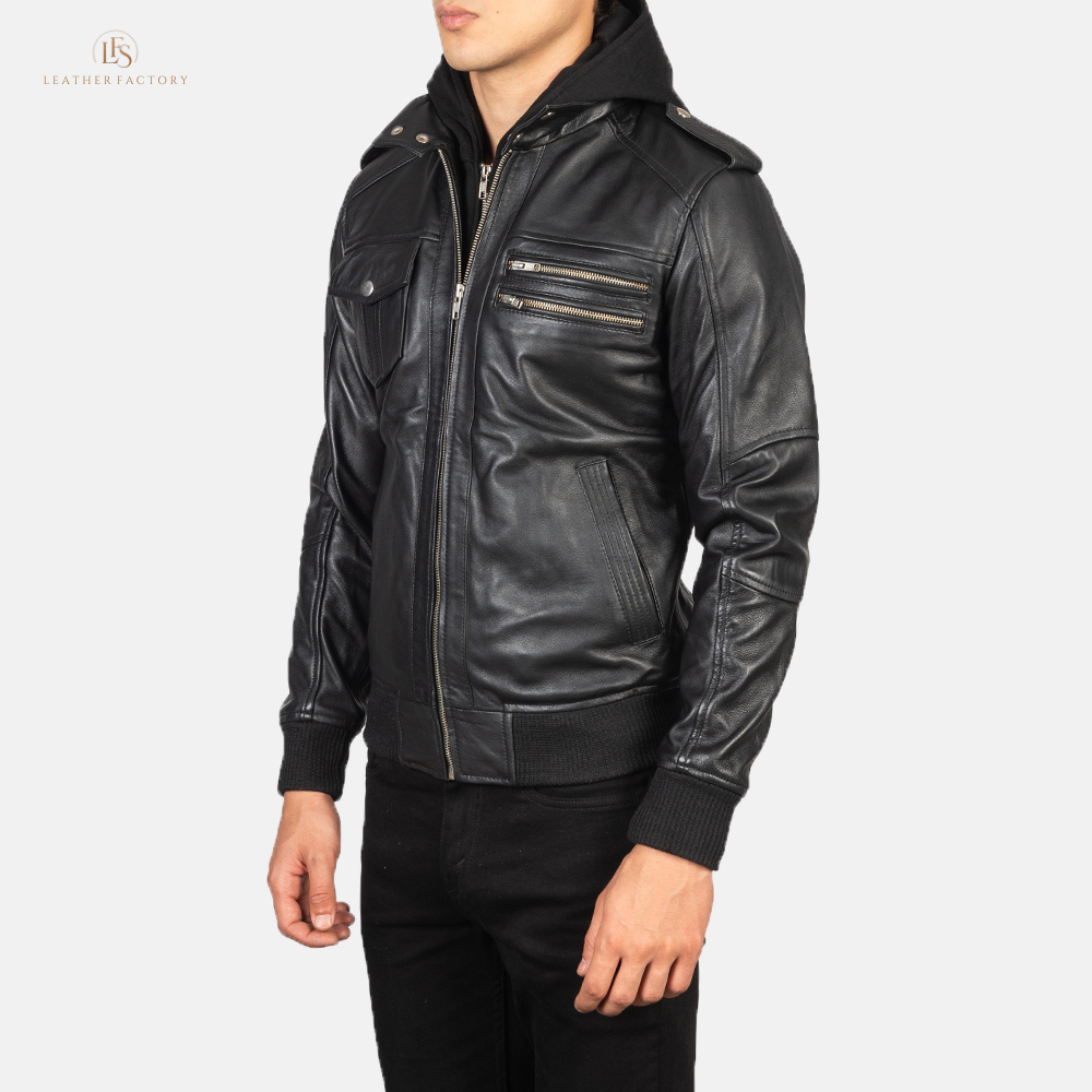 Man wearing a premium black leather bomber jacket with a removable hood and rib knit cuffs