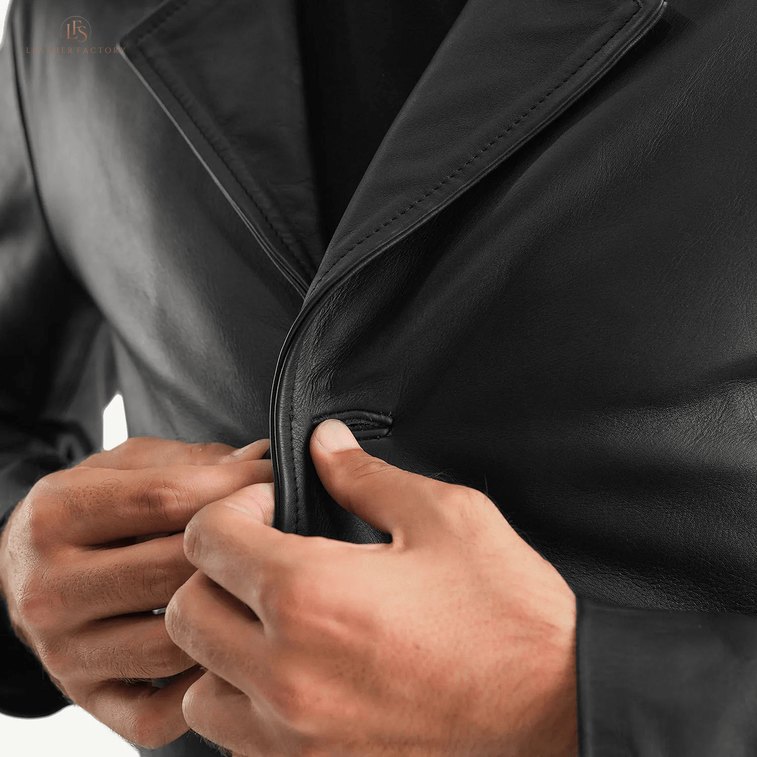 Man wearing a premium black genuine cowhide leather long coat with a sharp notch lapel and button front closure