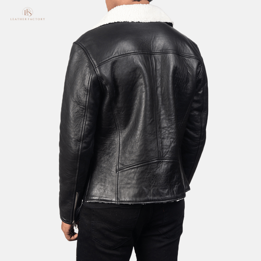 Man wearing a premium black and white contrast sheepskin leather jacket with faux fur lining and notch collar