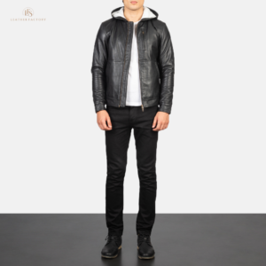 Man wearing a premium black sheepskin leather bomber jacket with integrated hood and snap button cuffs