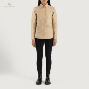 Woman wearing The Meridian beige sheepskin leather shirt jacket featuring a shirt-style collar and front leather button closure.