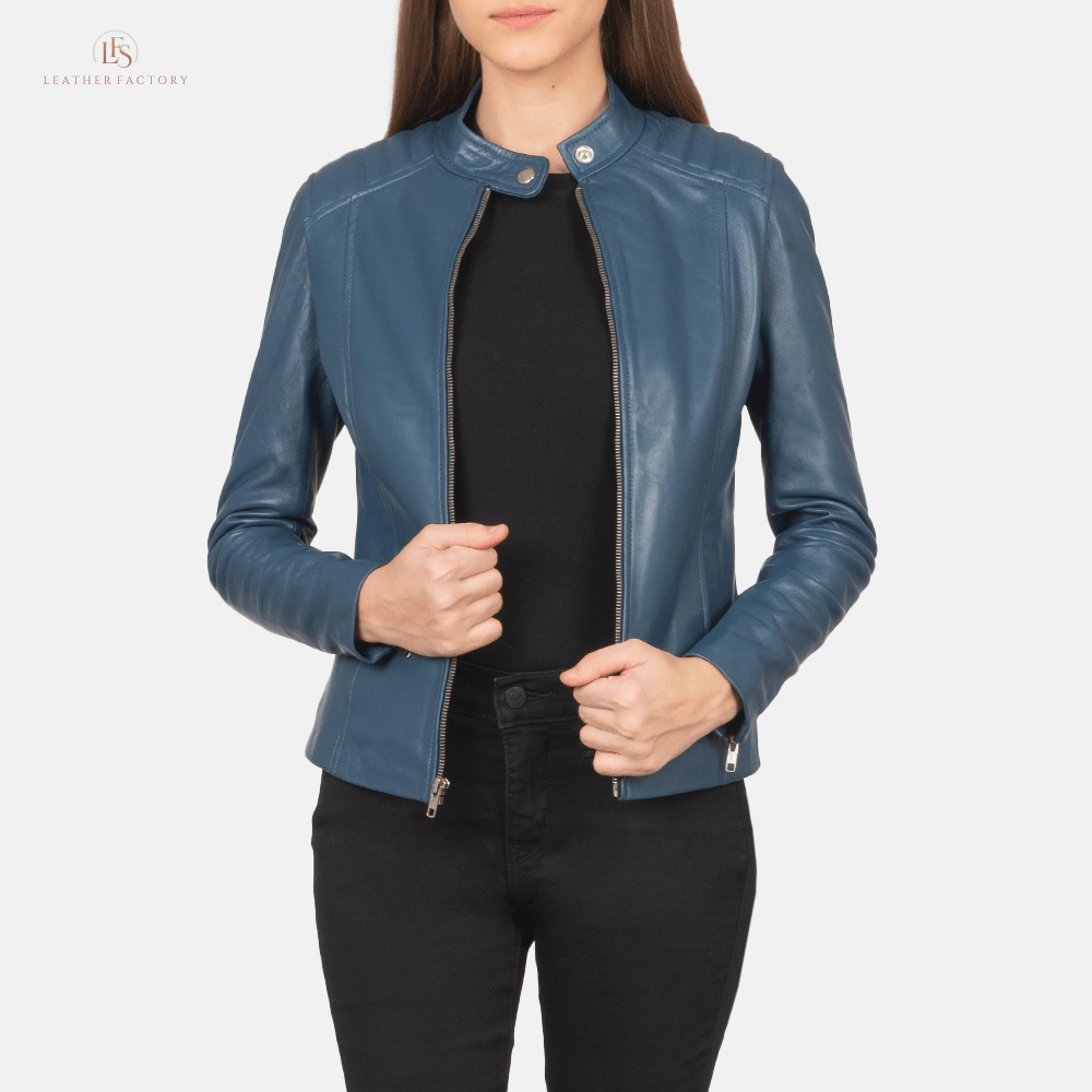 Woman wearing blue sheepskin leather slim fit biker jacket featuring quilted shoulders and a band collar with snap button.