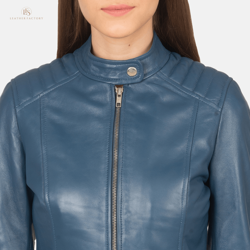 Woman wearing blue sheepskin leather slim fit biker jacket featuring quilted shoulders and a band collar with snap button.