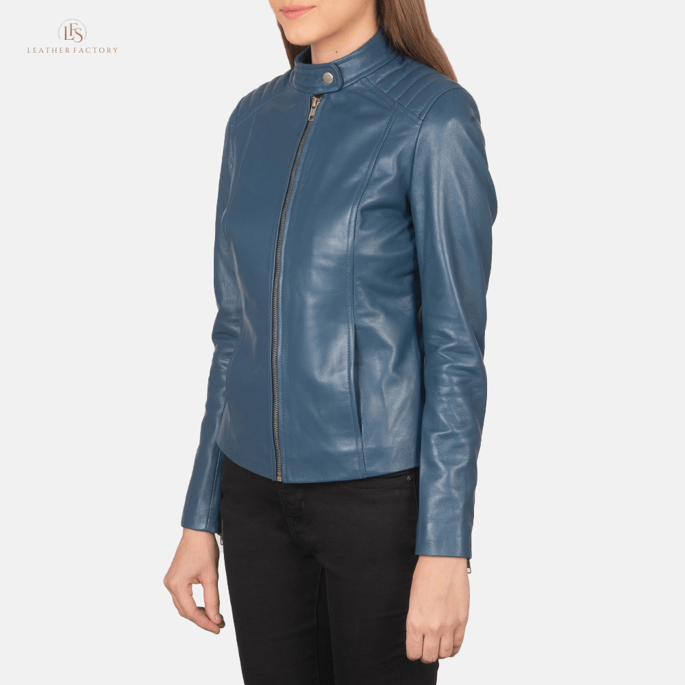 Woman wearing blue sheepskin leather slim fit biker jacket featuring quilted shoulders and a band collar with snap button.