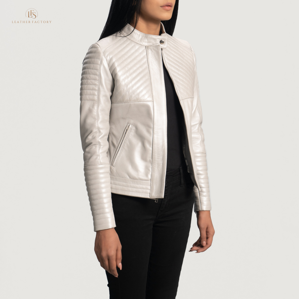 Woman wearing The Silver Quilted off-white sheepskin leather moto jacket featuring a band collar with snap button and zippered cuffs.