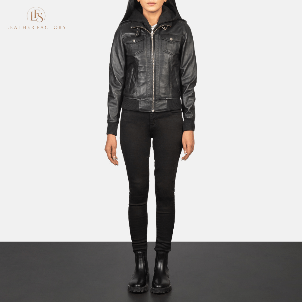 Woman wearing the Roslyn black sheepskin hooded leather bomber jacket featuring a high neck with belt, shoulder epaulettes, and a removable fabric hood.