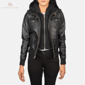 Woman wearing the Roslyn black sheepskin hooded leather bomber jacket featuring a high neck with belt, shoulder epaulettes, and a removable fabric hood.
